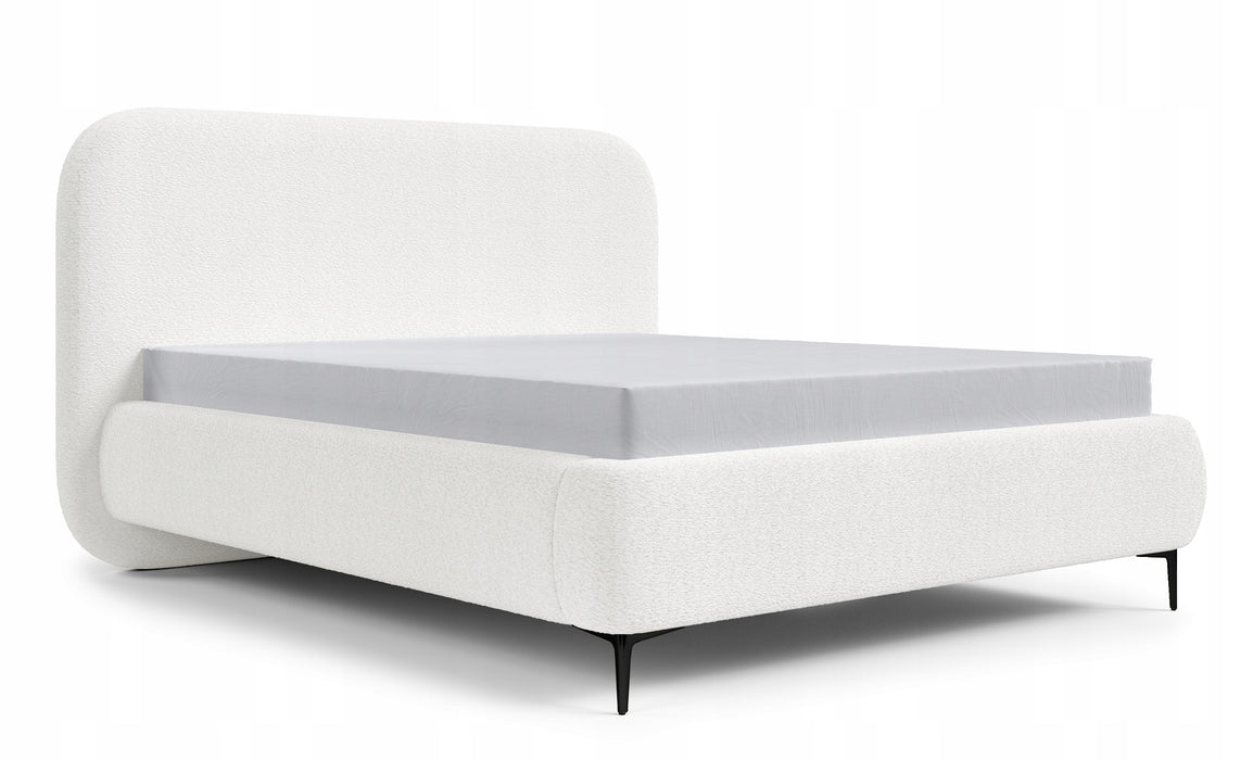 The bed is covered with boucle fabric