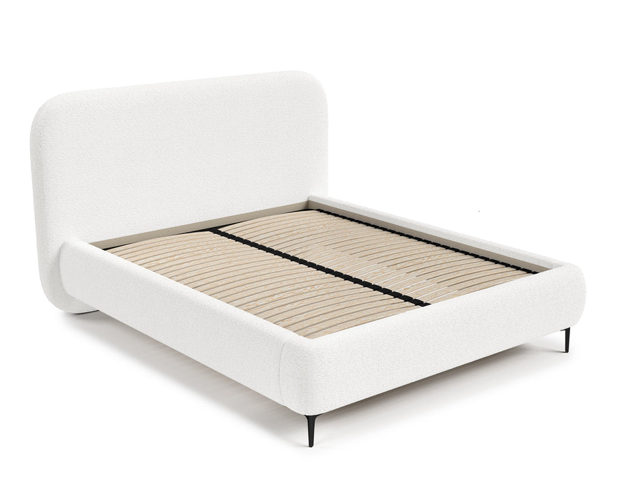 The bed is covered with boucle fabric
