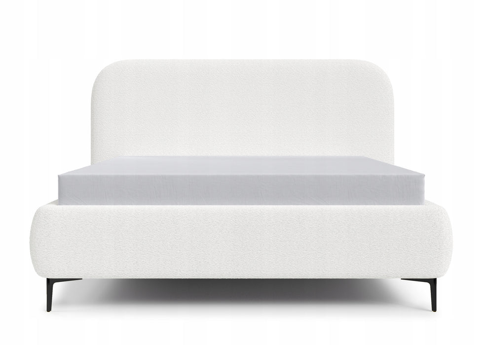 The bed is covered with boucle fabric