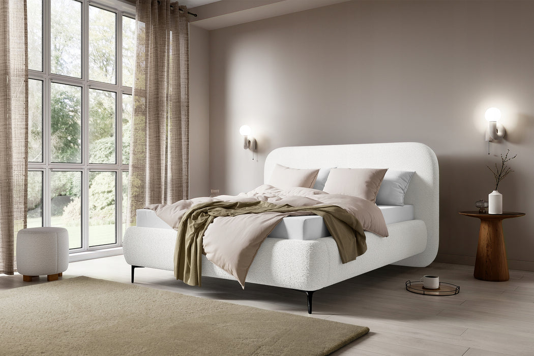 The bed is covered with boucle fabric