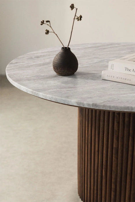 Round dining table made of natural stone and mango wood Giselda